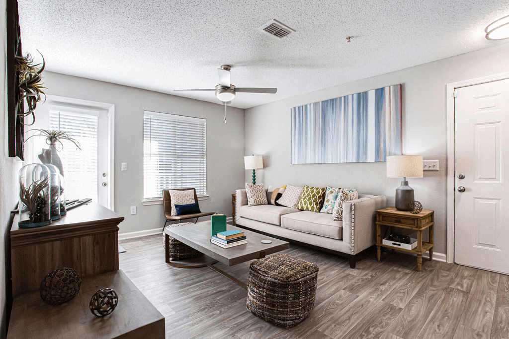 a living room with a couch and a coffee table  at Peaks at Gainesville, Georgia