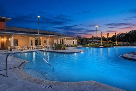 A swimming pool with a depth marker reading 4 feet.