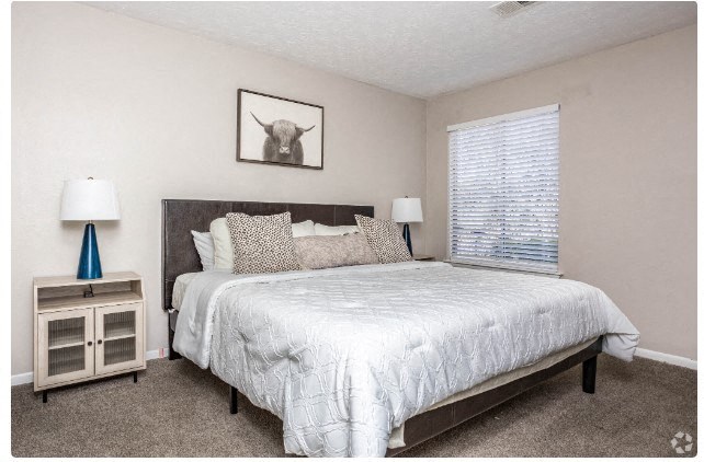 Bedroom with cozy bed at The Landing At Pleasantdale, Doraville, Georgia