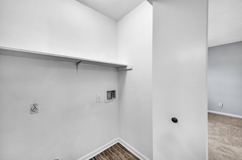 the living room of our studio apartment atrium with white walls and a lowered ceiling