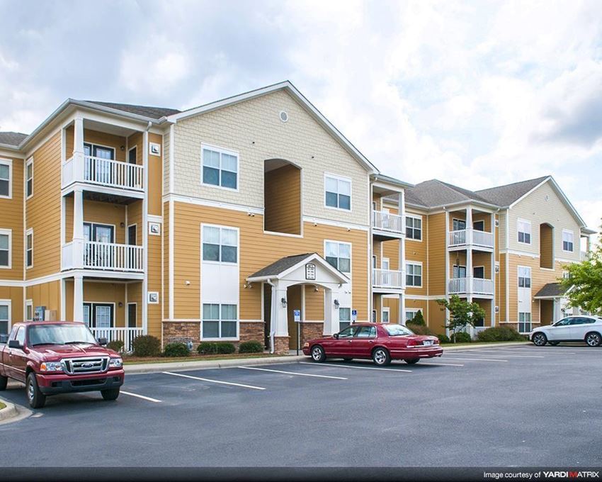 Parking lot and apartment balconies at the Haven at Market Street Station Apartments Johnson City, TN
