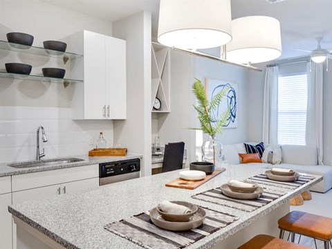 a kitchen with a counter top and a sink