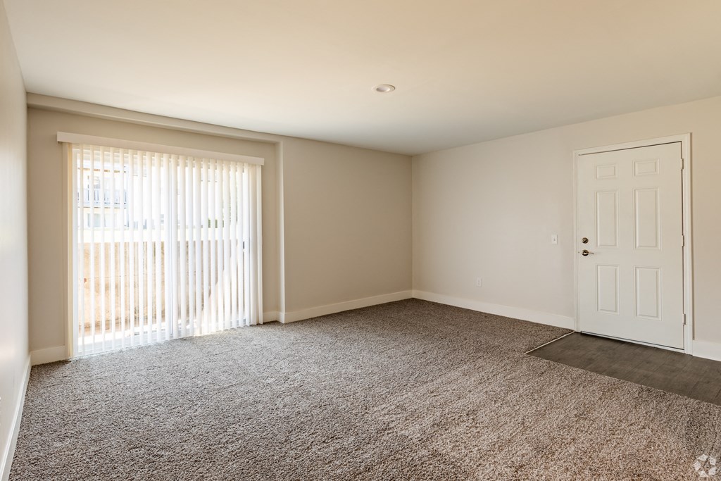 a bedroom with a door and a window