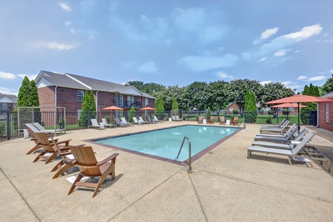 Community swimming pool with an expansive sundeck designed for recreation and relaxation.