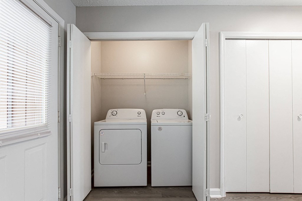a laundry room with two washes and a dryer in it