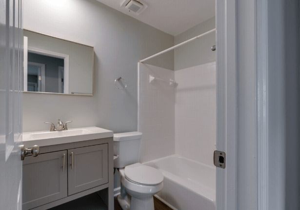 a bathroom with a sink toilet and a shower at Crescent Place Apartment, Savannah