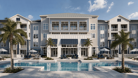 A large, modern building with a pool in front.