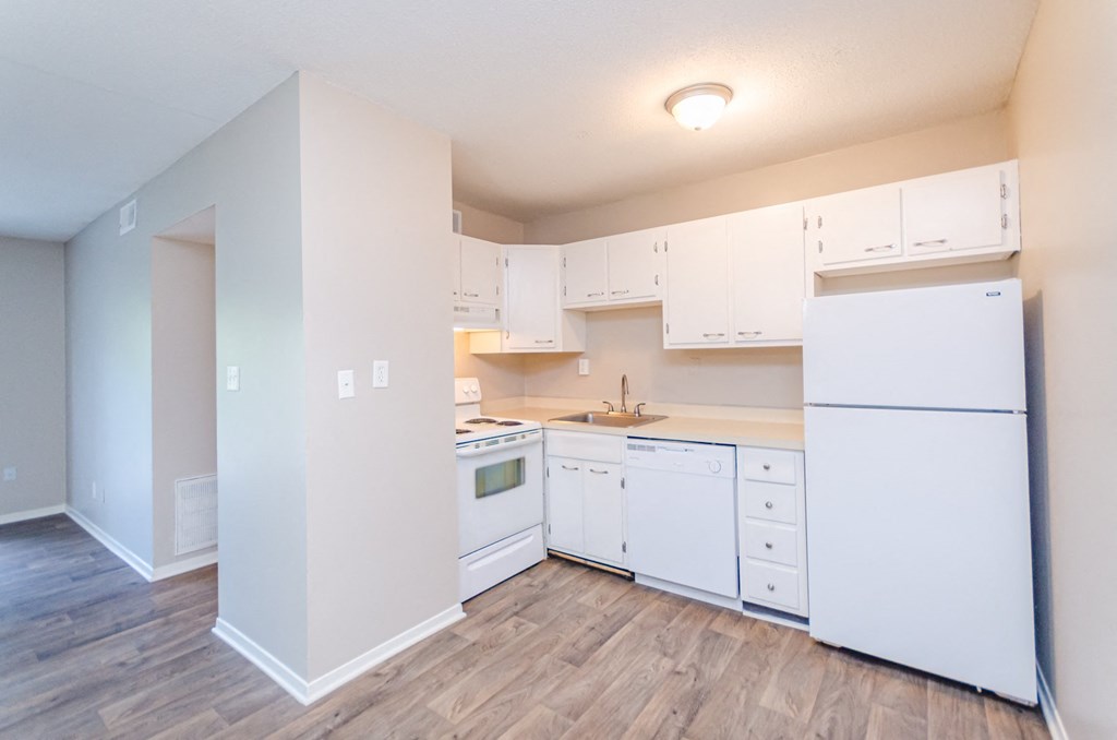 a kitchen with white appliances and white cabinets at Summit East Ridge, East Ridge, TN