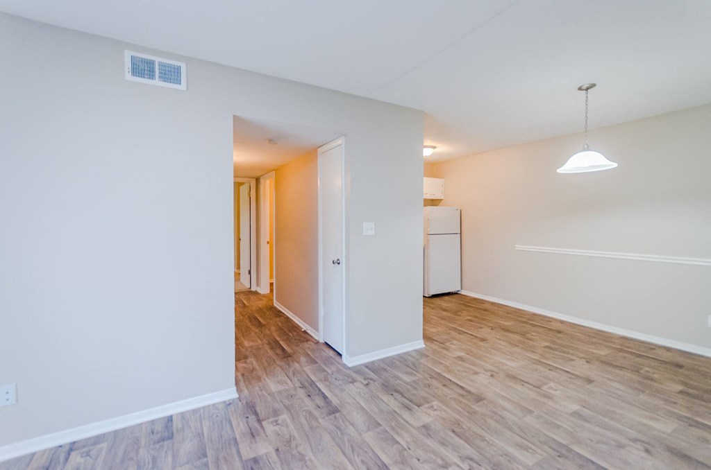 a bedroom with hardwood flooring and white walls at Summit East Ridge, East Ridge