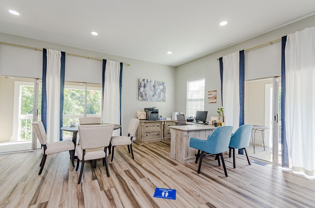 a common area with a desk and chairs and a table with a computer on it at Summit East Ridge, East Ridge, TN 