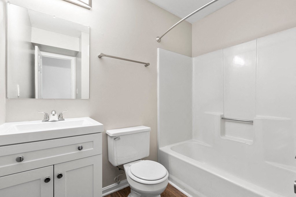 a bathroom with a sink toilet and bathtub