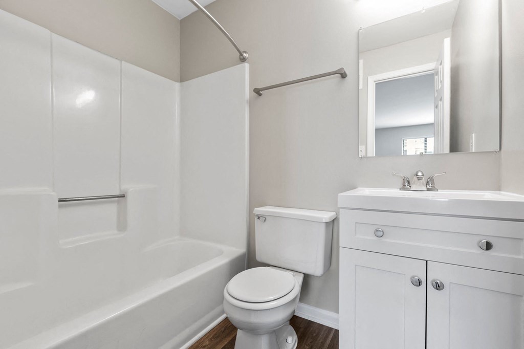 a bathroom with a toilet sink and bathtub