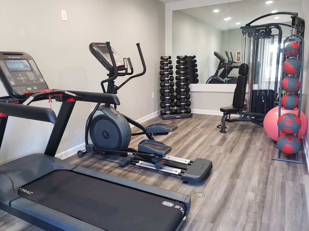 a gym with cardio equipment and weights at Summit East Ridge, Tennessee, 37412