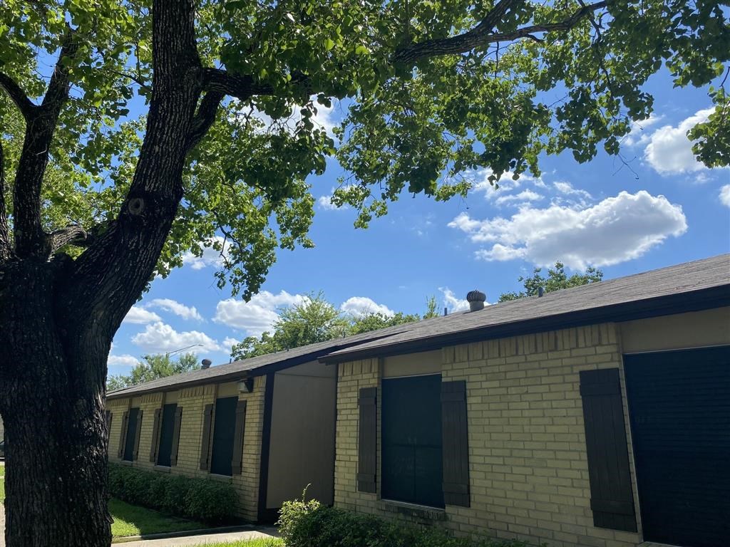 a building with a tree in front of it