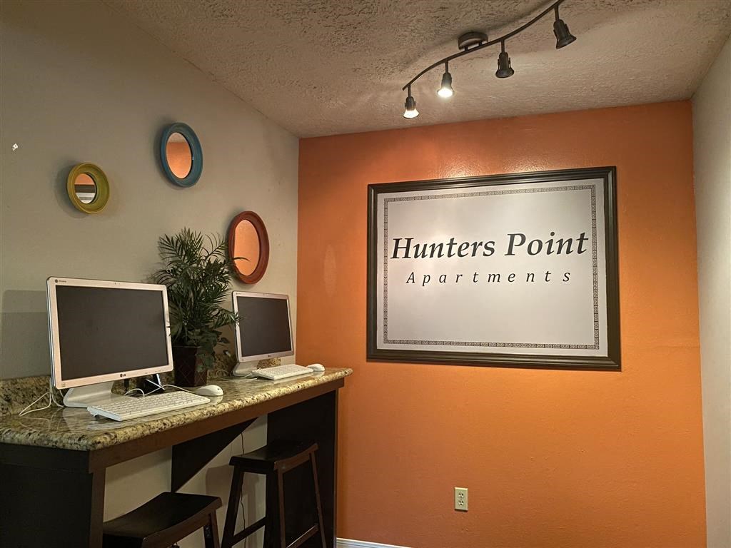 a home office with two computer monitors on a desk