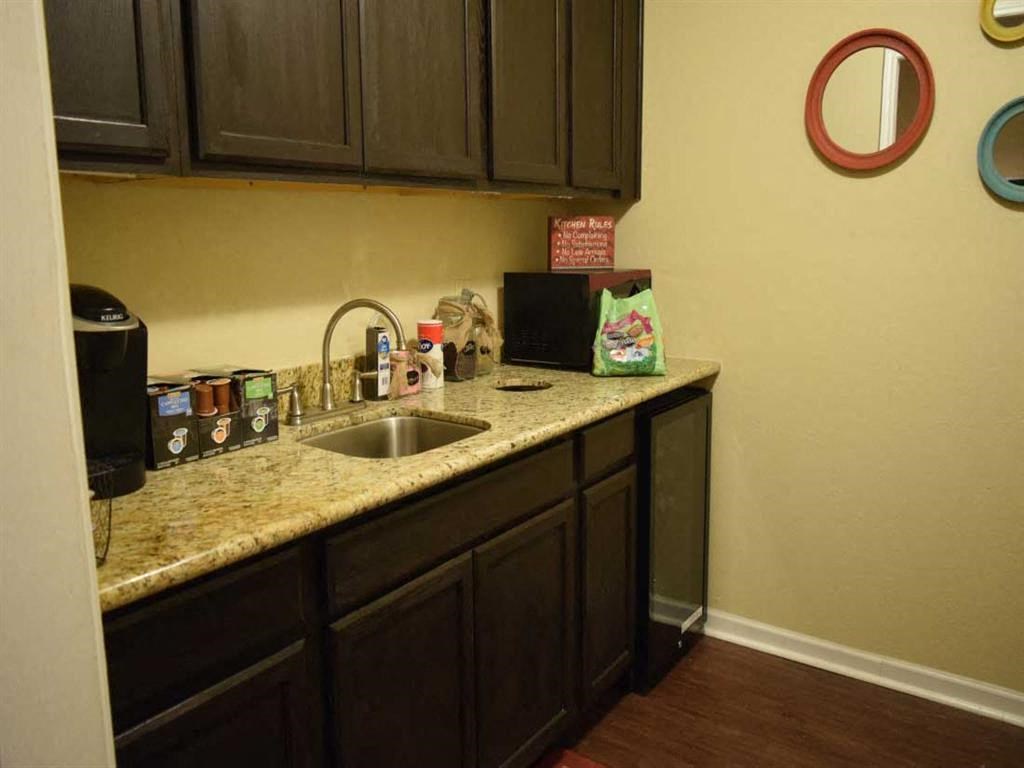 a kitchen with a sink and a counter top