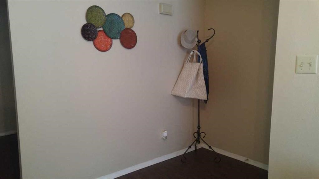 a towel rack with a bag hanging on a wall