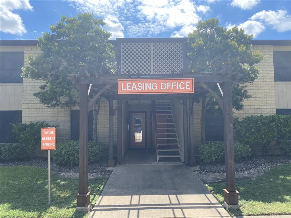 the entrance to the leasing office of a building