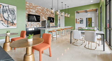 A modern dining room with a round table and chairs.