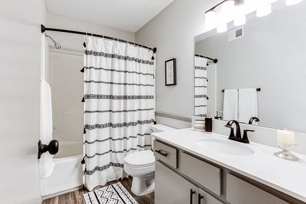 a bathroom with a sink toilet and shower at The Laurel, Union City