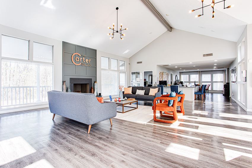 a living room with couches and chairs and a fireplace