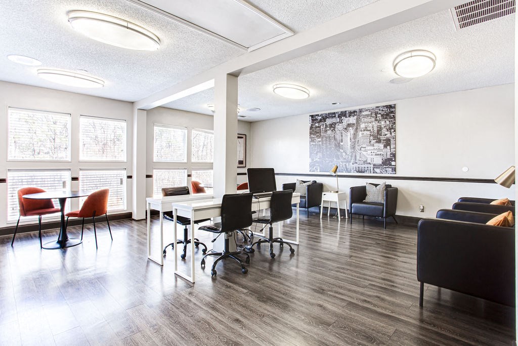 a conference room with chairs and tables and a large window