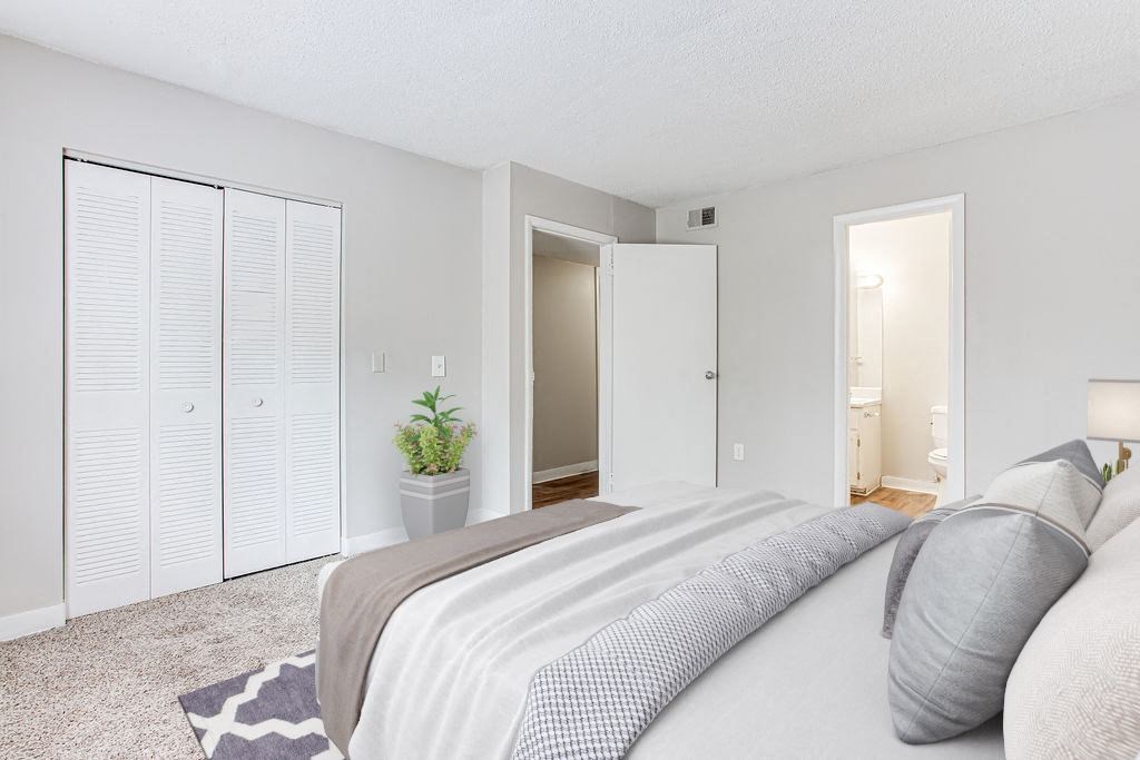 a bedroom with a large bed and a closet at Lory of Harbison, South Carolina