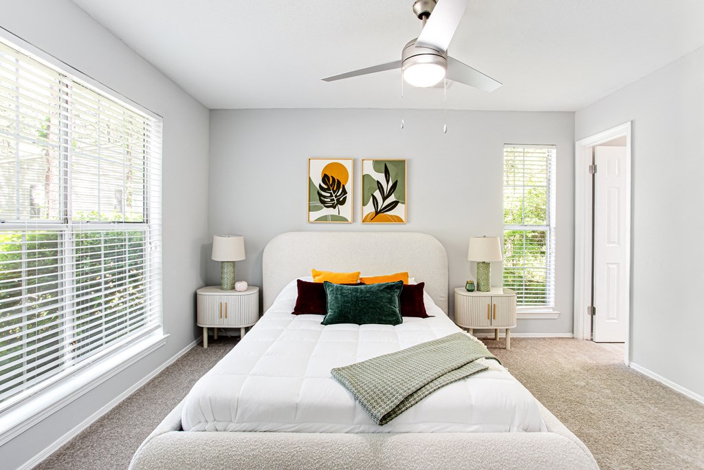 a bedroom with a large white bed and a ceiling fan at Parc at 1875, College Park, GA