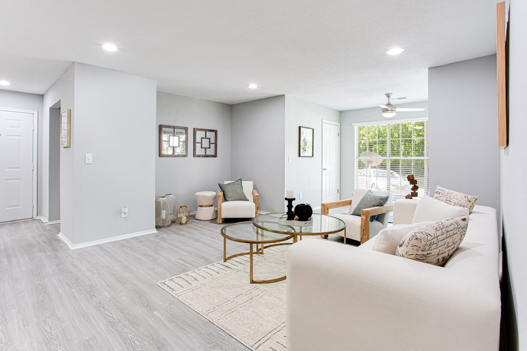 a living room with a couch and a coffee table at Parc at 1875, College Park, Georgia
