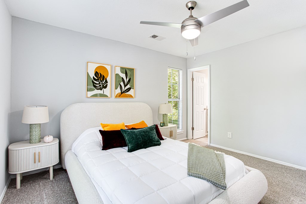 a bedroom with a large bed and a ceiling fan at Parc at 1875, Georgia