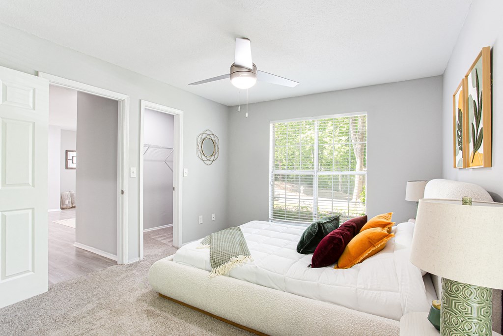 a bedroom with a large bed and a ceiling fan at Parc at 1875, Georgia