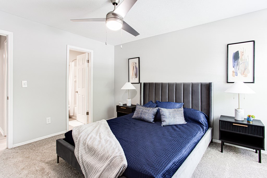 a bedroom with a large bed and a ceiling fan at Parc at 1875, College Park, Georgia