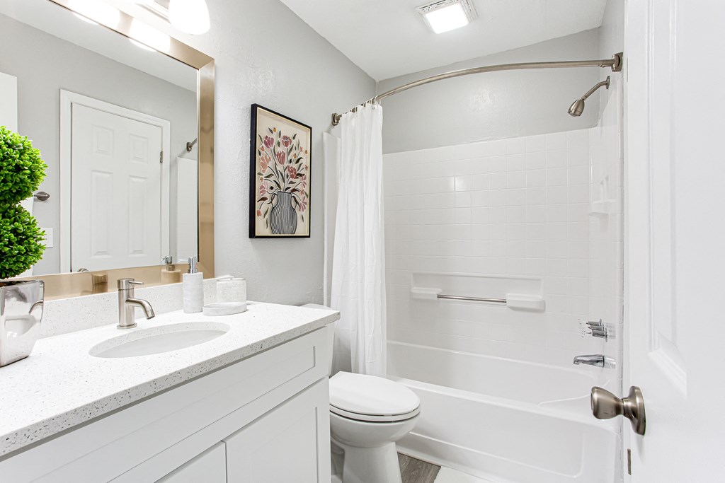 a bathroom with a shower toilet and sink at Parc at 1875, College Park, Georgia
