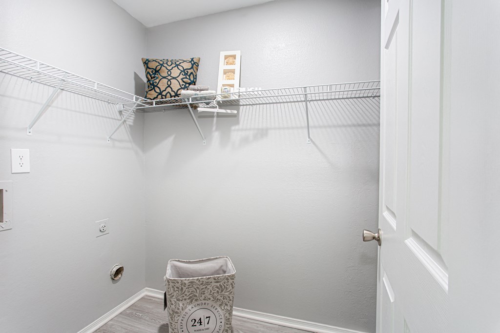 a spacious closet with a chair and a shelf on the wall at Parc at 1875, Georgiaat Parc at 1875, College Park, GA