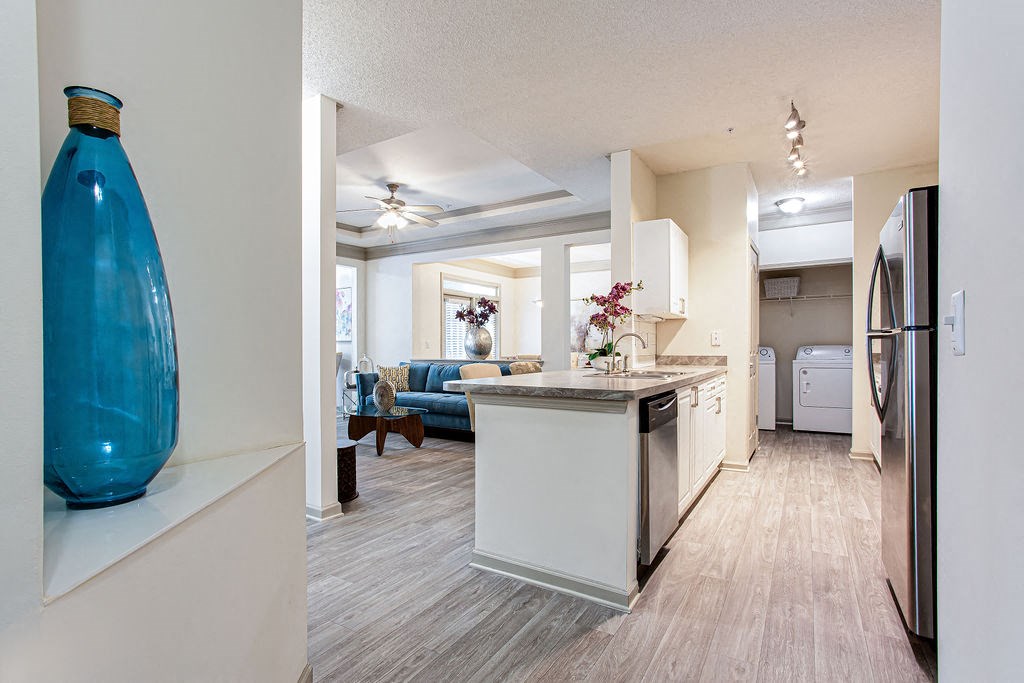 a kitchen and living room in a 555 waverly unit