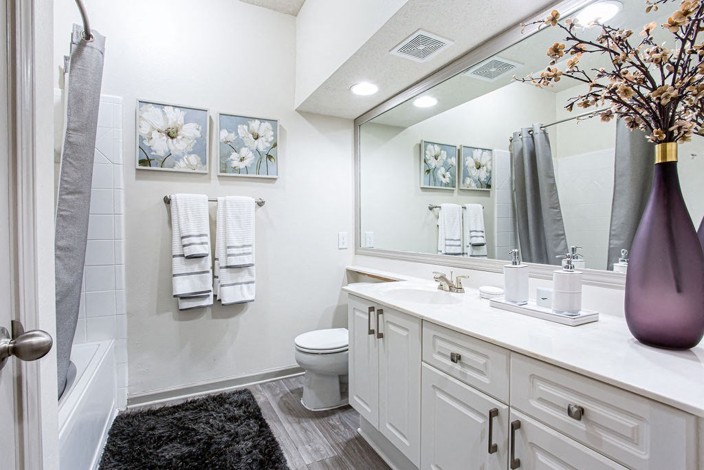 a bathroom with a large mirror