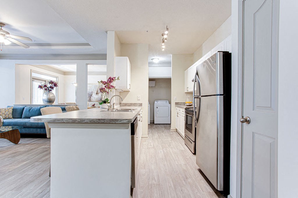 a kitchen and living room in a 555 waverly unit