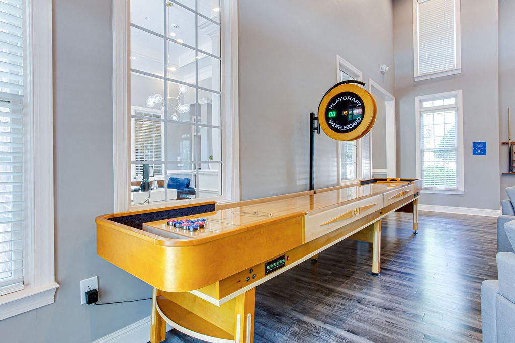 a games room with a foosball table and a ping pong table