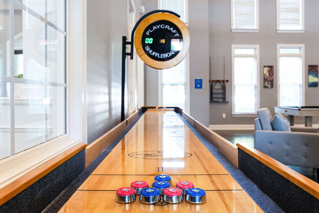 a ping pong table in front of a large window