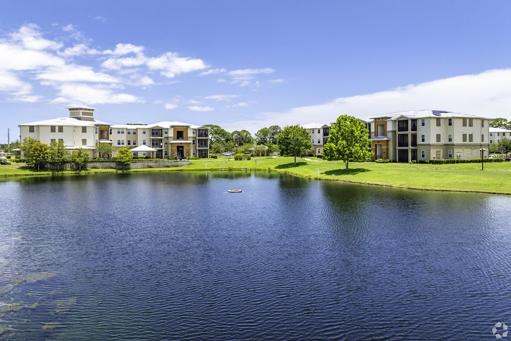 a body of water with houses on the other side of it at Ventura at Turtle Creek, Rockledge, Florida