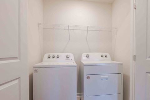 a laundry room with two washes and a dryer in it