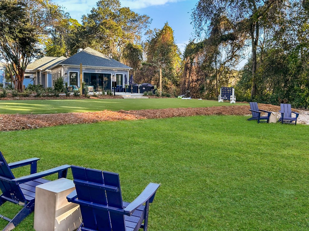 A house with a porch and a garden in front.