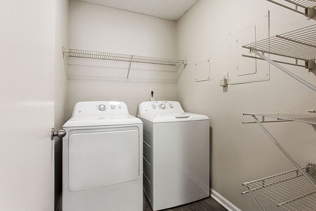 a laundry room with two washes and a dryer in it