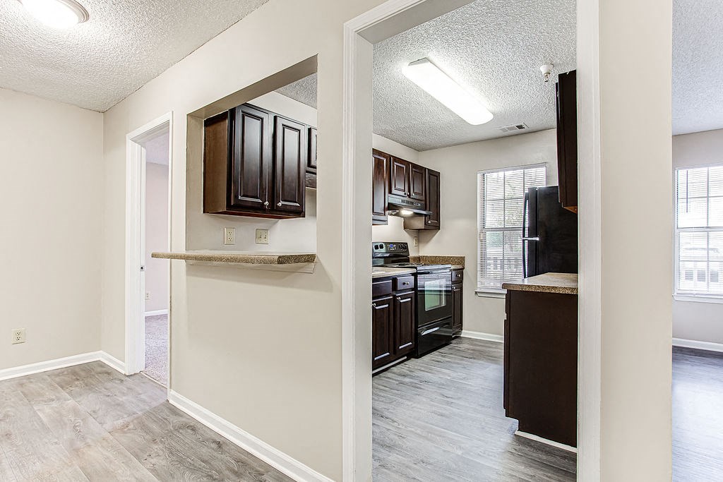 a view of a kitchen and a living room