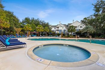a hot tub next to a pool