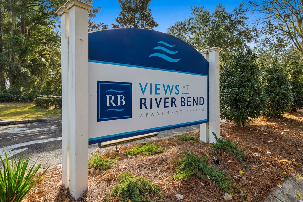 A sign for Views at River Bend Apartment Living.