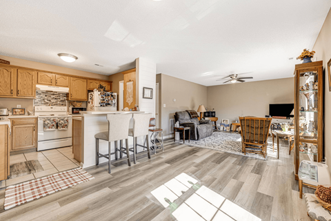 the living room is open to the kitchen and dining area