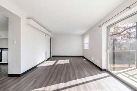 A room with wooden floors and white walls.