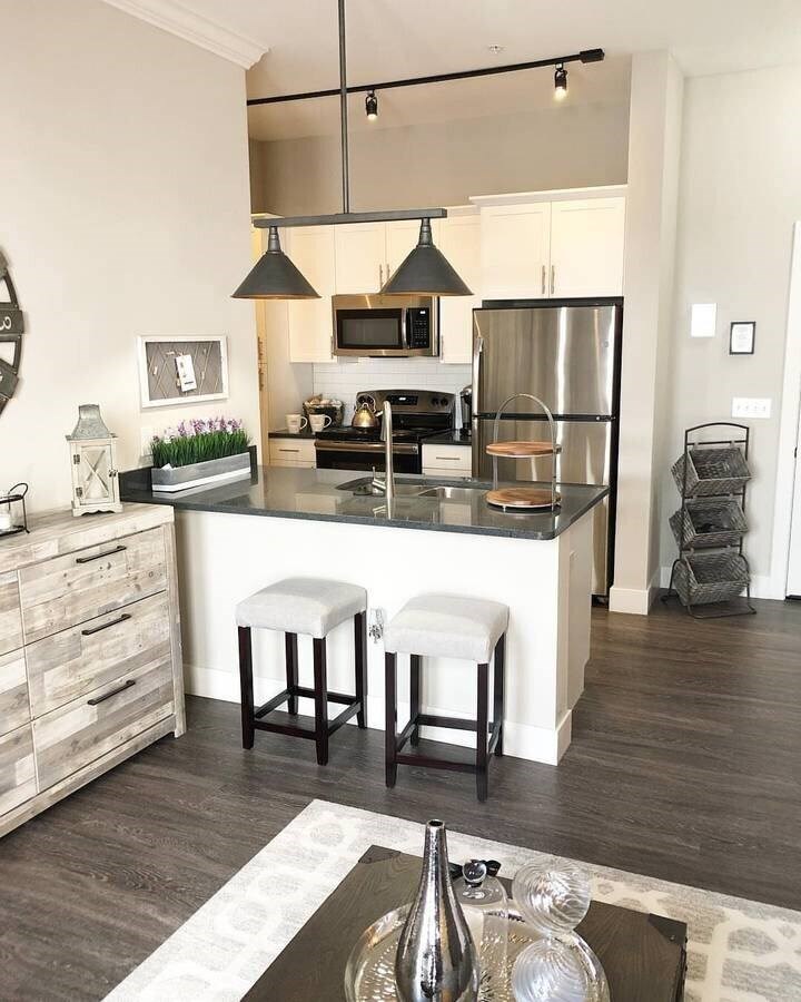 A modern kitchen with a bar stool in front of the island.at Century Baxter Avenue, Kentucky, 40204