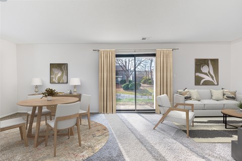 A modern living room with a dining table and chairs.